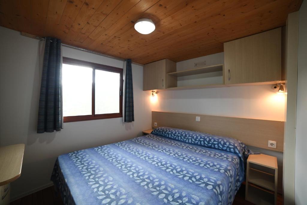 Säng eller sängar i ett rum på Camping C'era Una Volta