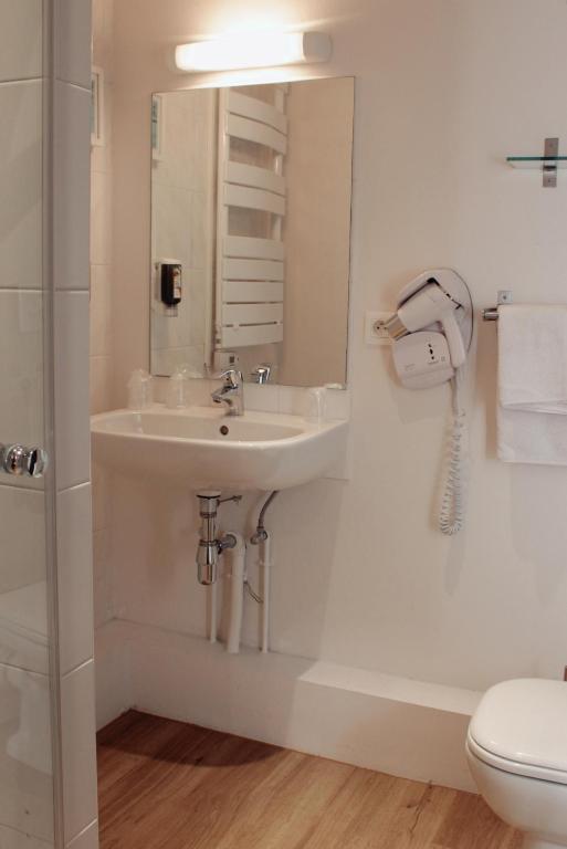 Koupelna v ubytování Le Gouverneur Hotel