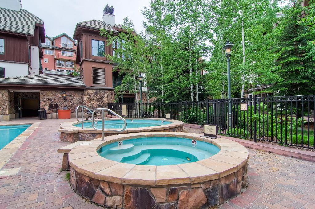 a hot tub in the middle of a patio at Villa Montane by East West Hospitality in Beaver Creek