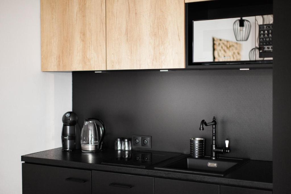 Kuchyňa alebo kuchynka v ubytovaní Miód Malvina Apartamenty