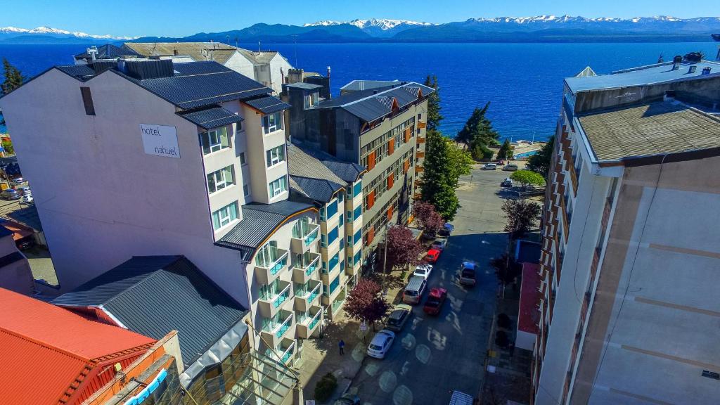 an overhead view of a building with the ocean in the background at Hotel Ayres Del Nahuel in San Carlos de Bariloche