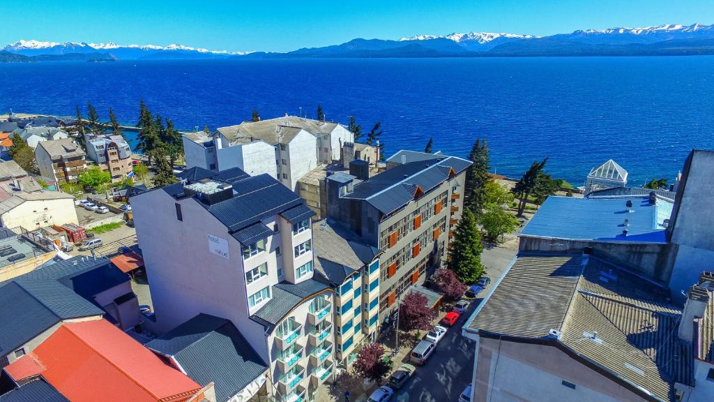 an aerial view of a city and the water at Hotel Ayres Del Nahuel in San Carlos de Bariloche