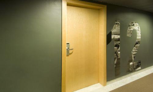 a wooden door on a wall in a room at Hotel Nautico in Santa Cruz de Tenerife