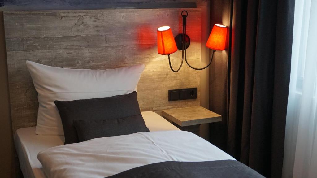 Postel nebo postele na pokoji v ubytování Urban Home Hotel