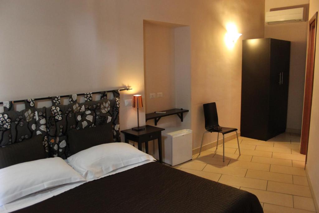 Łóżko lub łóżka w pokoju w obiekcie San Lorenzo Rooms