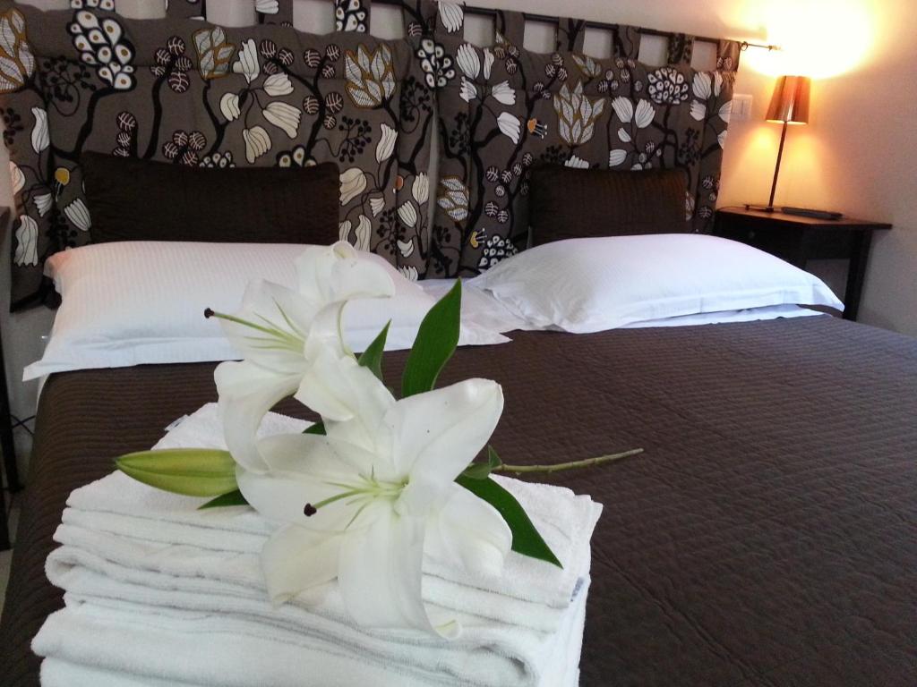 Łóżko lub łóżka w pokoju w obiekcie San Lorenzo Rooms