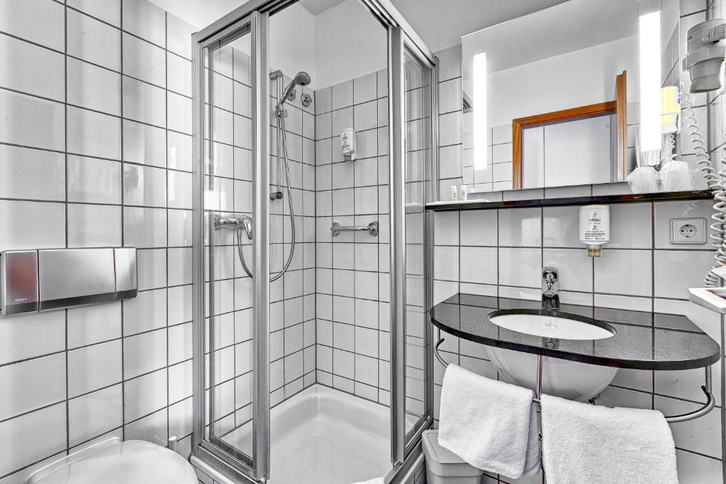 Koupelna v ubytování attimo Hotel Stuttgart***S