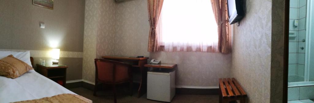 Postel nebo postele na pokoji v ubytování Garni Hotel Lav