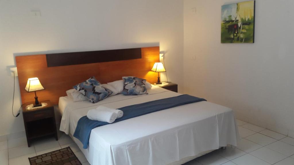 Katil atau katil-katil dalam bilik di Giuseppe Suites Hotel