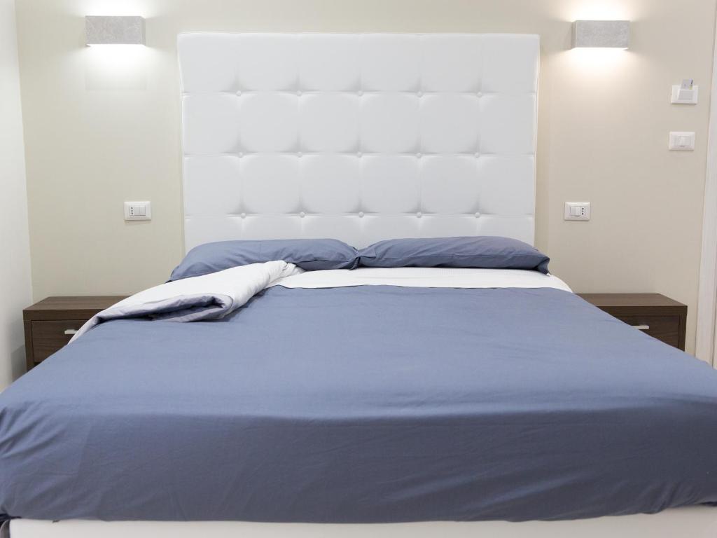 Postel nebo postele na pokoji v ubytování Venustas Roma Hotel