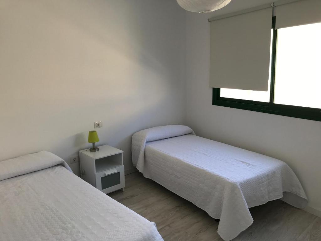 A bed or beds in a room at Habour Side II