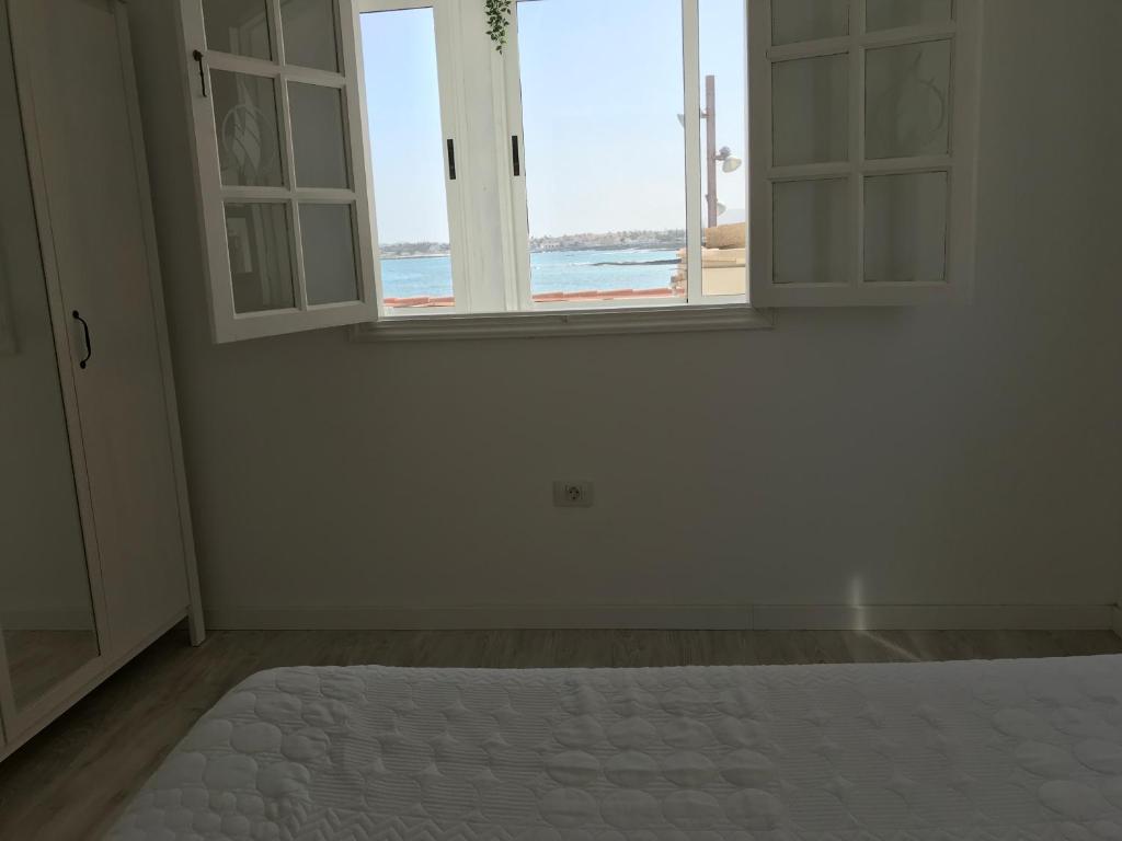 A bed or beds in a room at Habour Side II