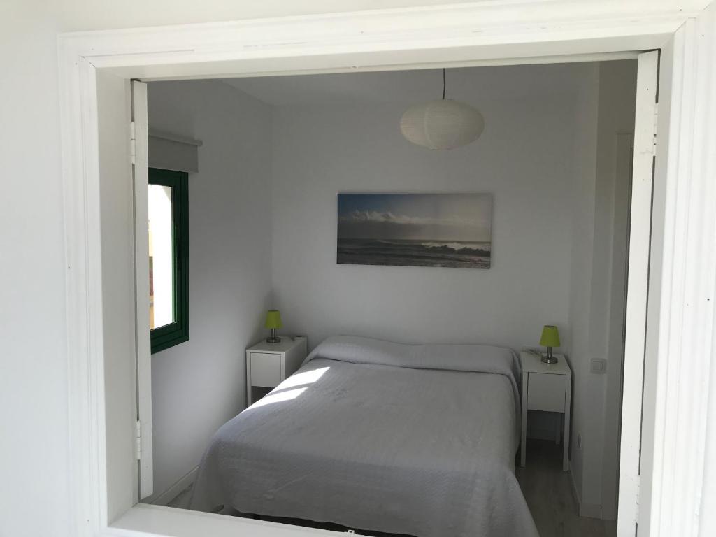 A bed or beds in a room at Habour Side II