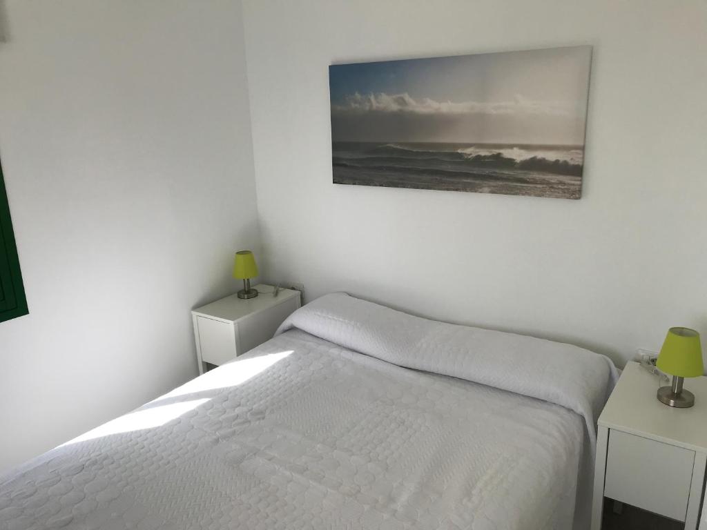 A bed or beds in a room at Habour Side II