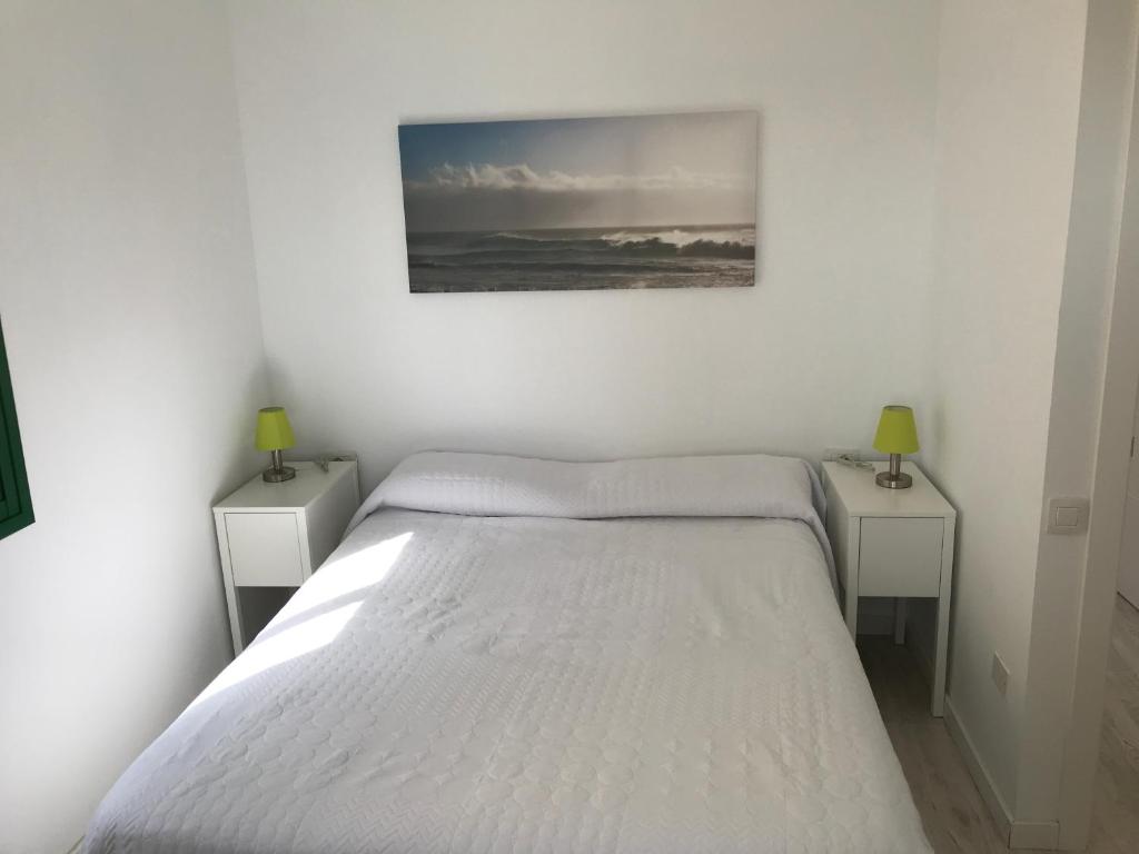 A bed or beds in a room at Habour Side II