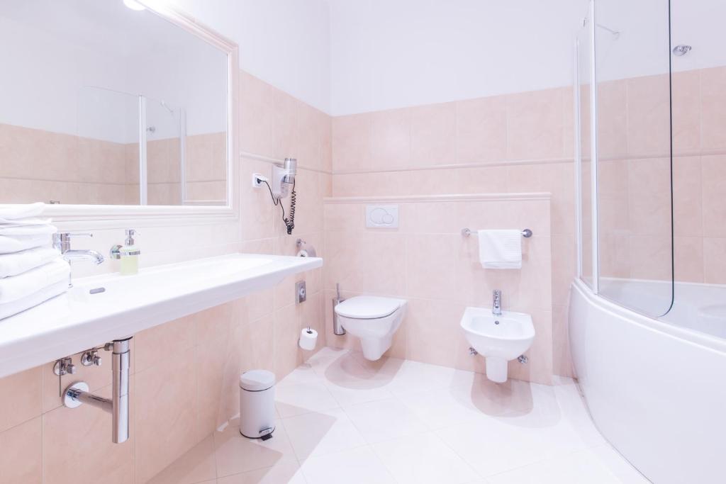 Koupelna v ubytování Unitas Hotel