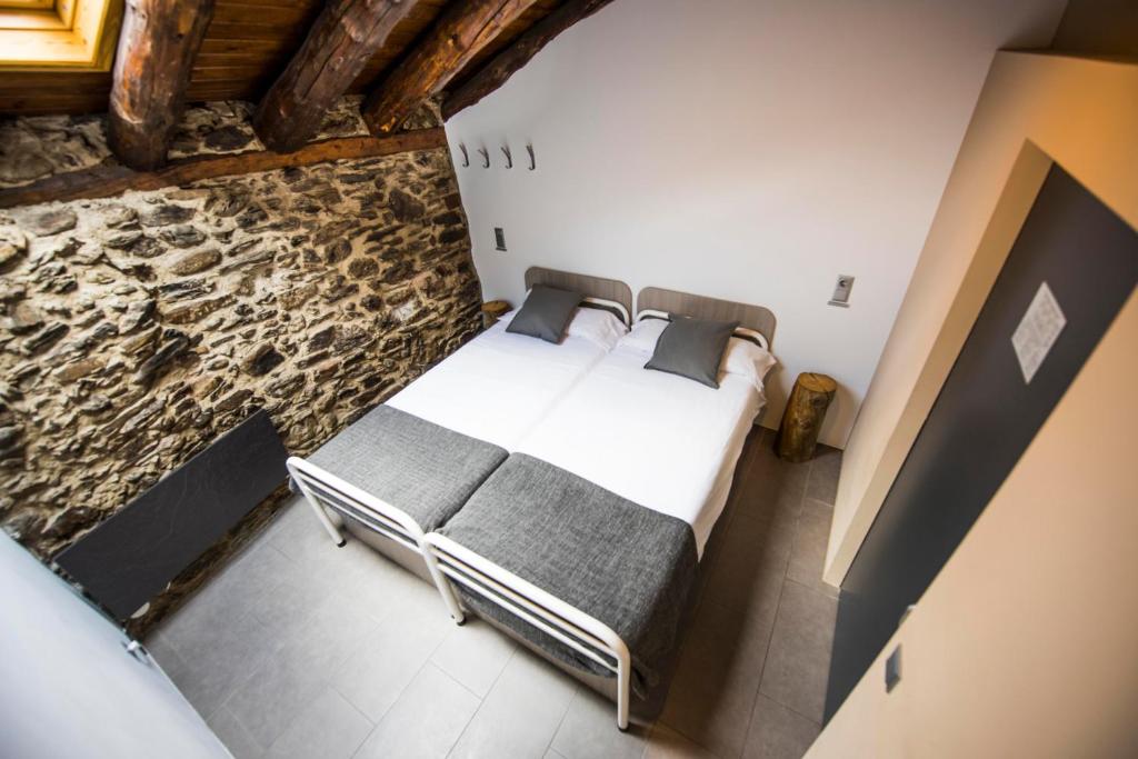 Postel nebo postele na pokoji v ubytování Mountain Hostel Tarter