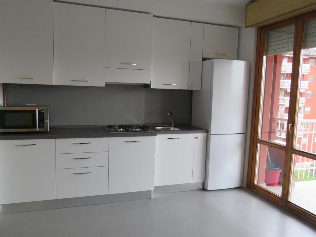 Kuchyň nebo kuchyňský kout v ubytování Assago Forum Apartment