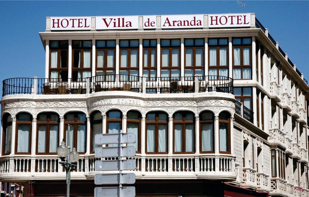a large building with a large window on the side of it at Hotel Villa de Aranda in Aranda de Duero
