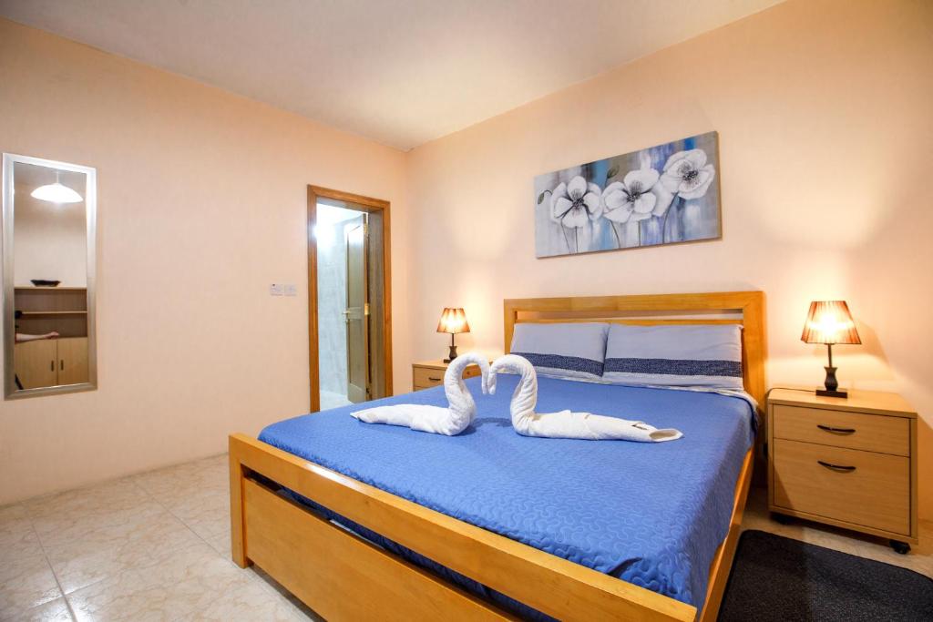 Postel nebo postele na pokoji v ubytování Victoria Penthouse