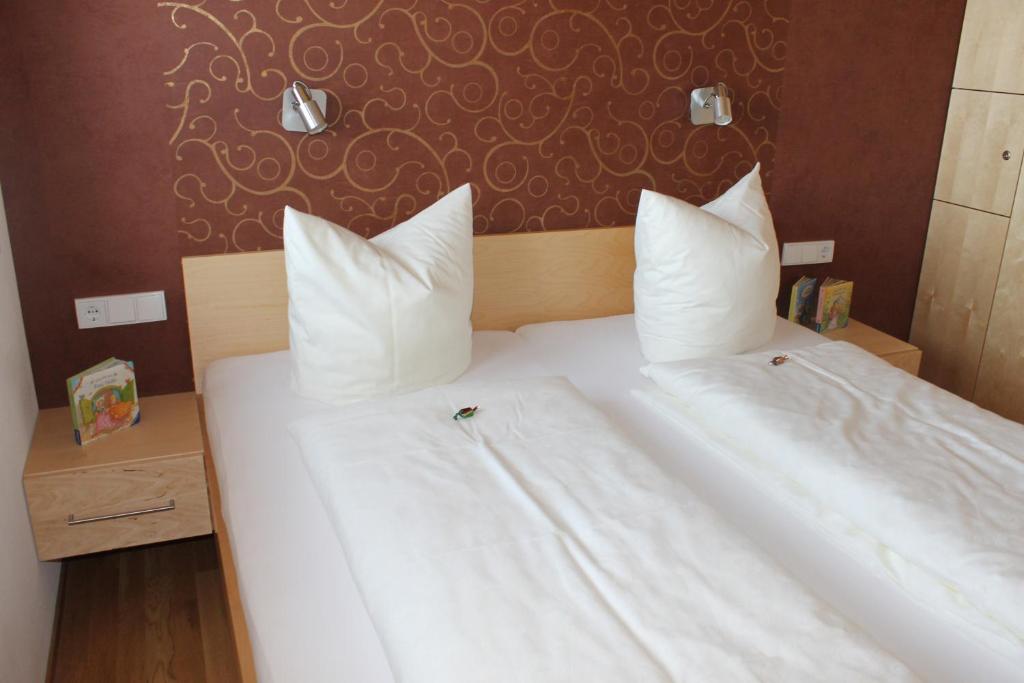 Posteľ alebo postele v izbe v ubytovaní Appartements Aurora