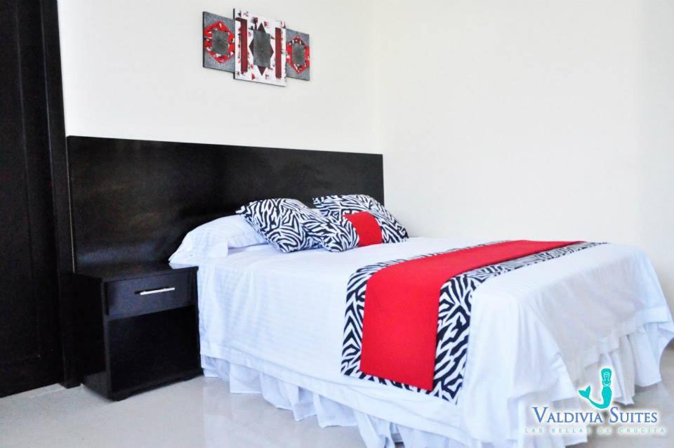 Postel nebo postele na pokoji v ubytování Valdivia Suites