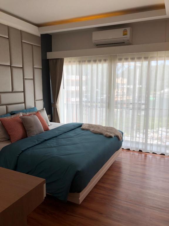 Postel nebo postele na pokoji v ubytování Samui Paca place