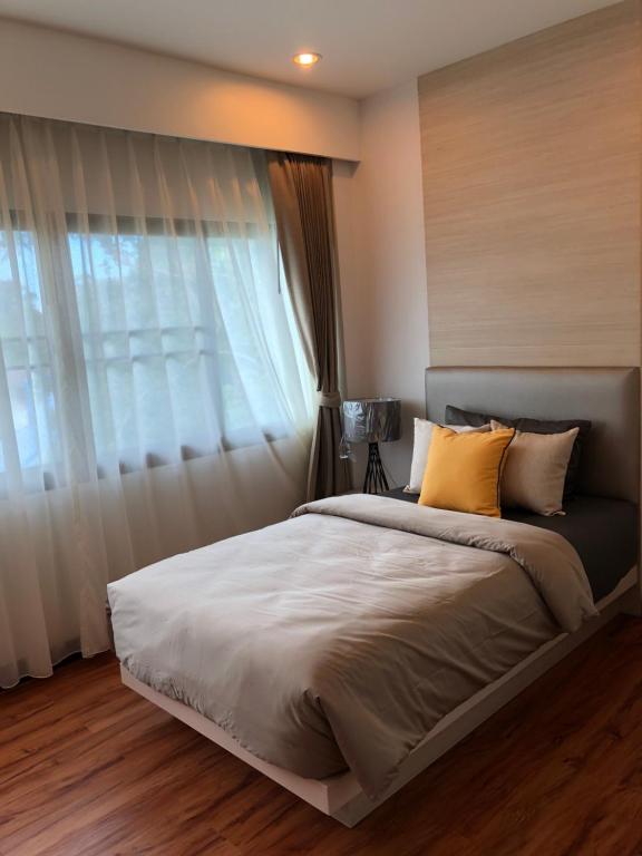 Postel nebo postele na pokoji v ubytování Samui Paca place