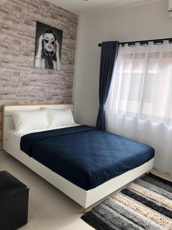 Postel nebo postele na pokoji v ubytování Samui Paca place
