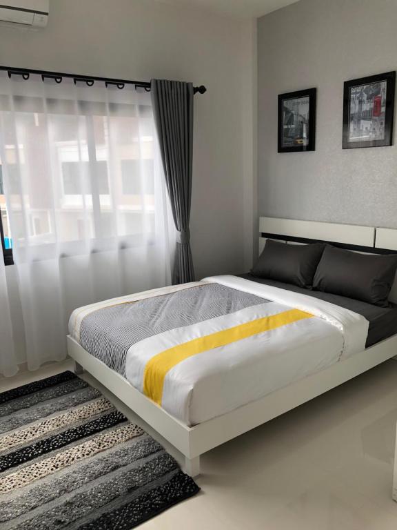 Postel nebo postele na pokoji v ubytování Samui Paca place