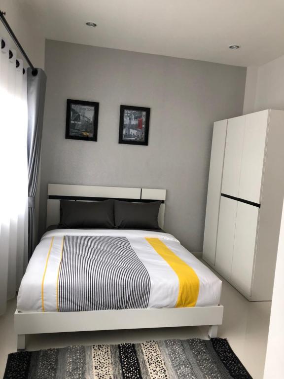 Postel nebo postele na pokoji v ubytování Samui Paca place