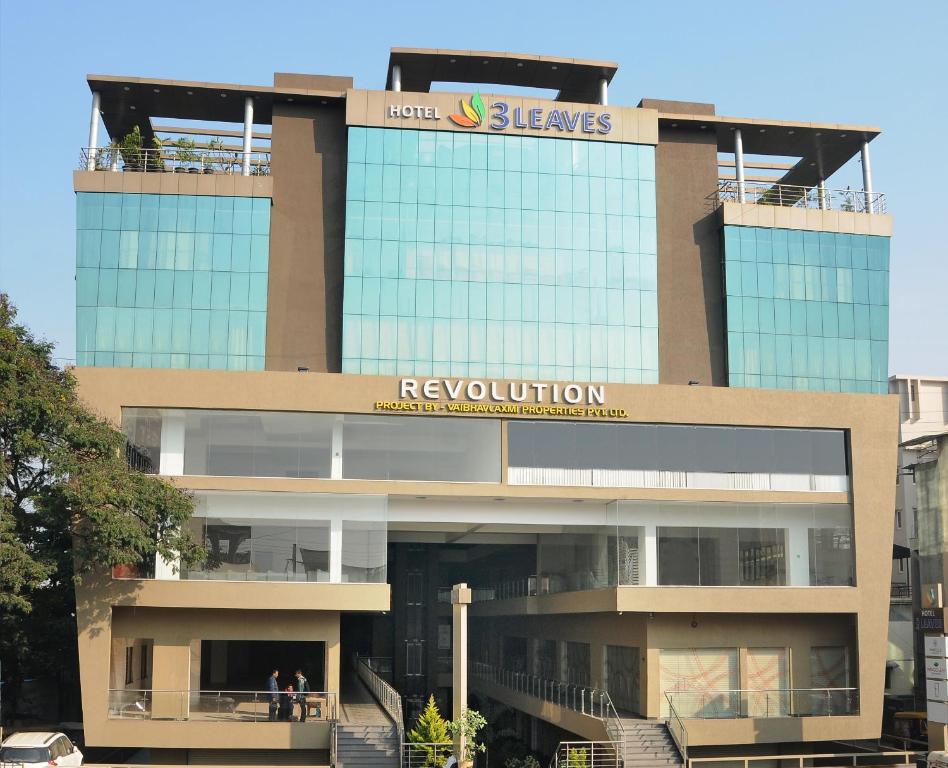 a building with a reynovation sign on top of it at Hotel 3 Leaves in Kolhapur