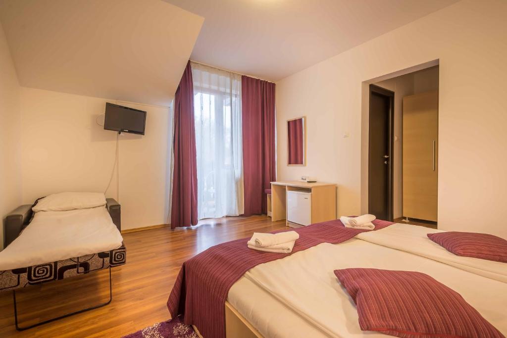Postel nebo postele na pokoji v ubytování Vila Rigo Sovata