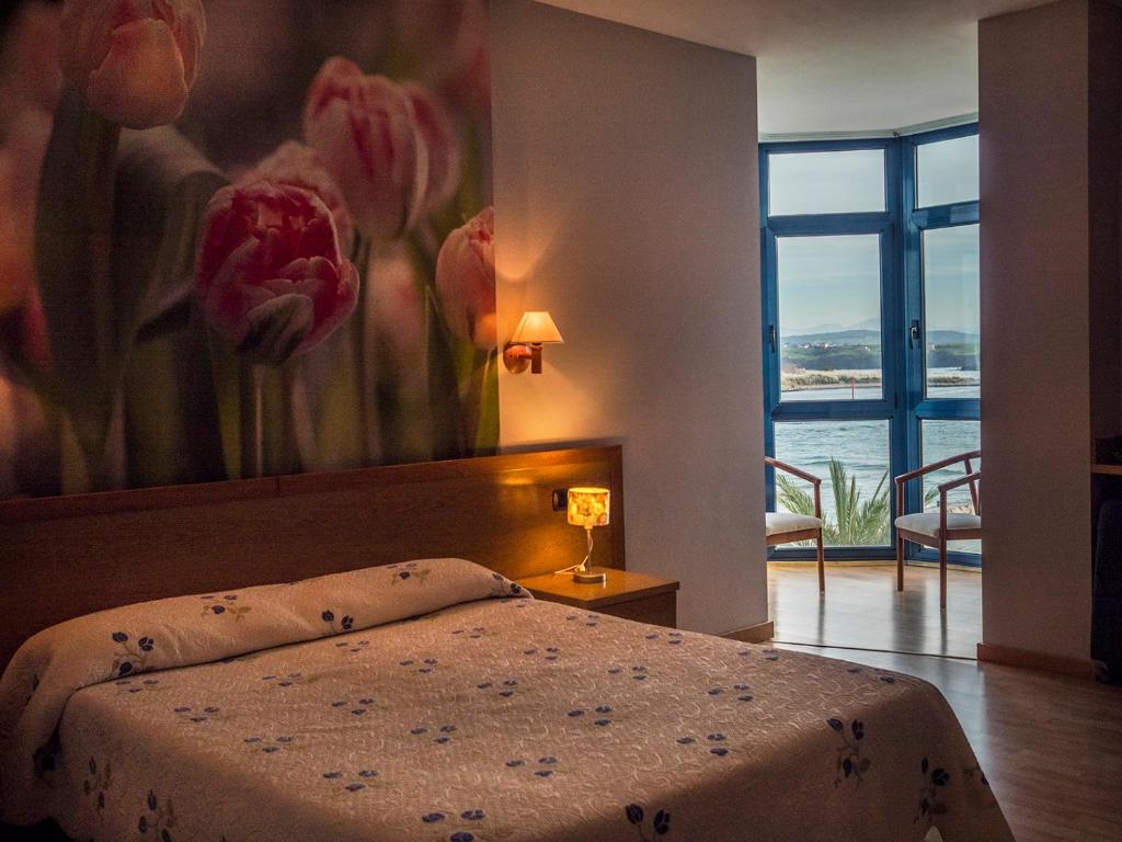 A bed or beds in a room at Hotel Soraya