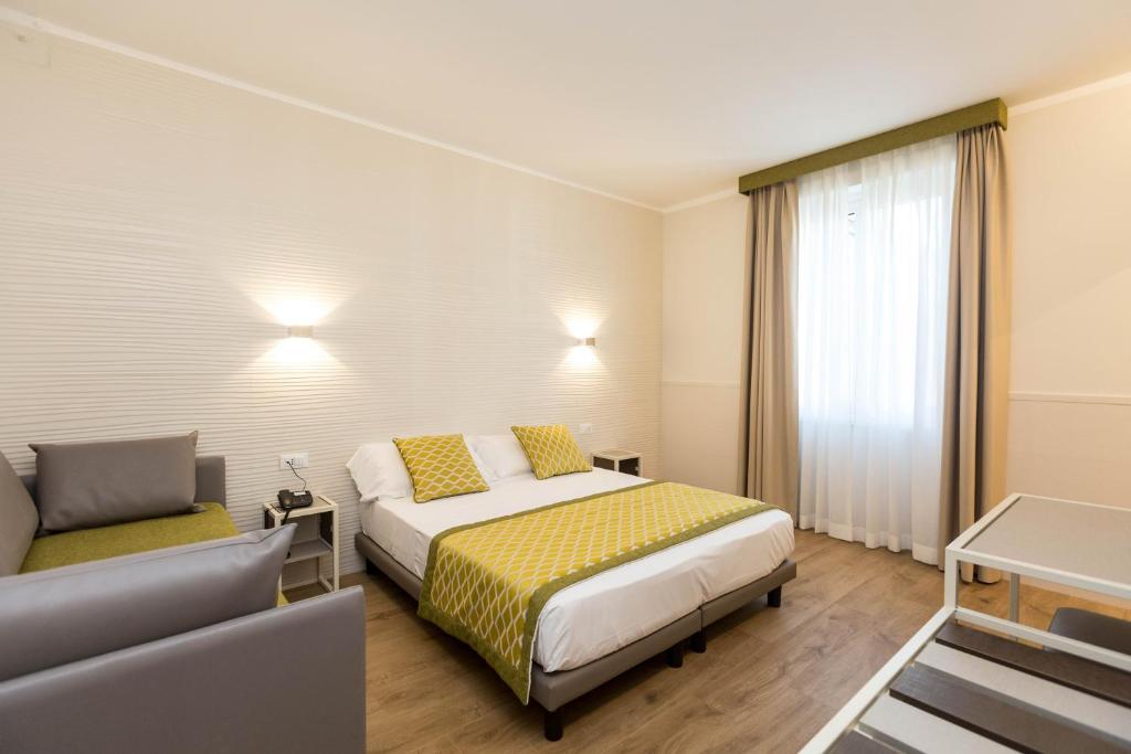 Postel nebo postele na pokoji v ubytování Hotel Marco Polo Rome