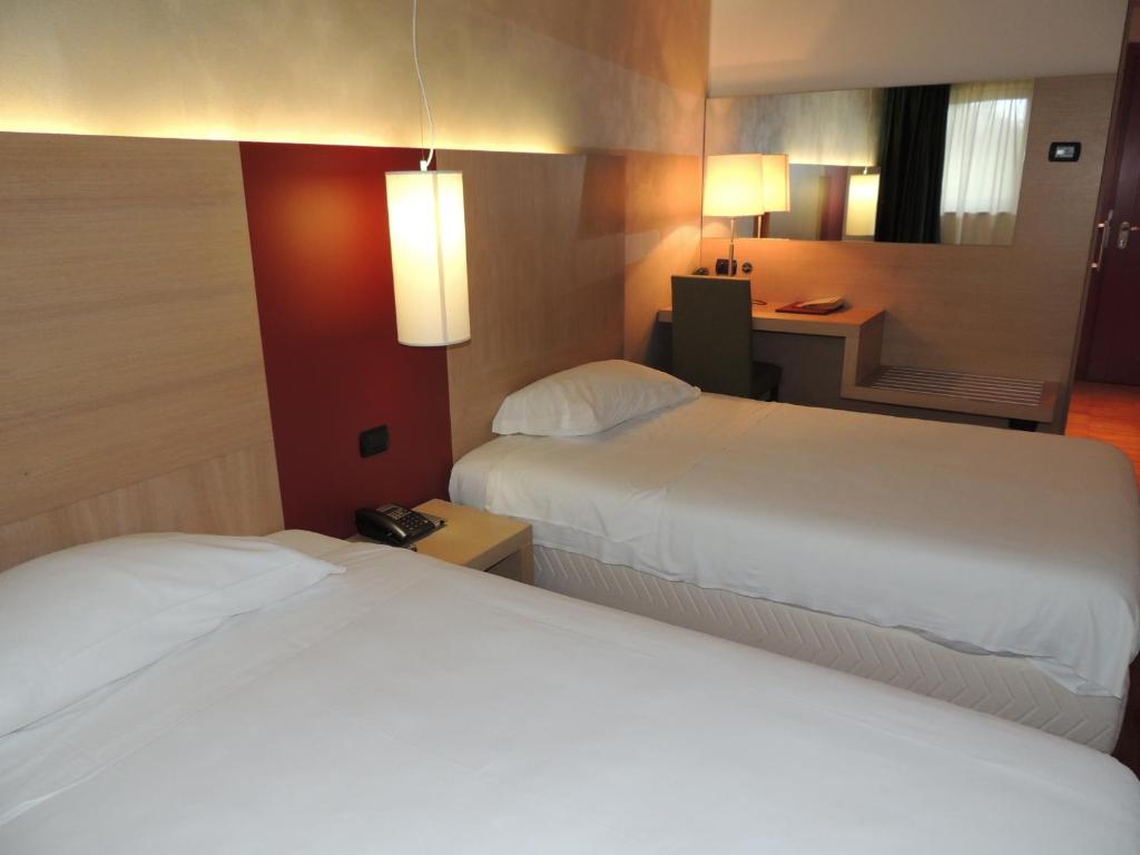 Postel nebo postele na pokoji v ubytování Cascina Scova Resort