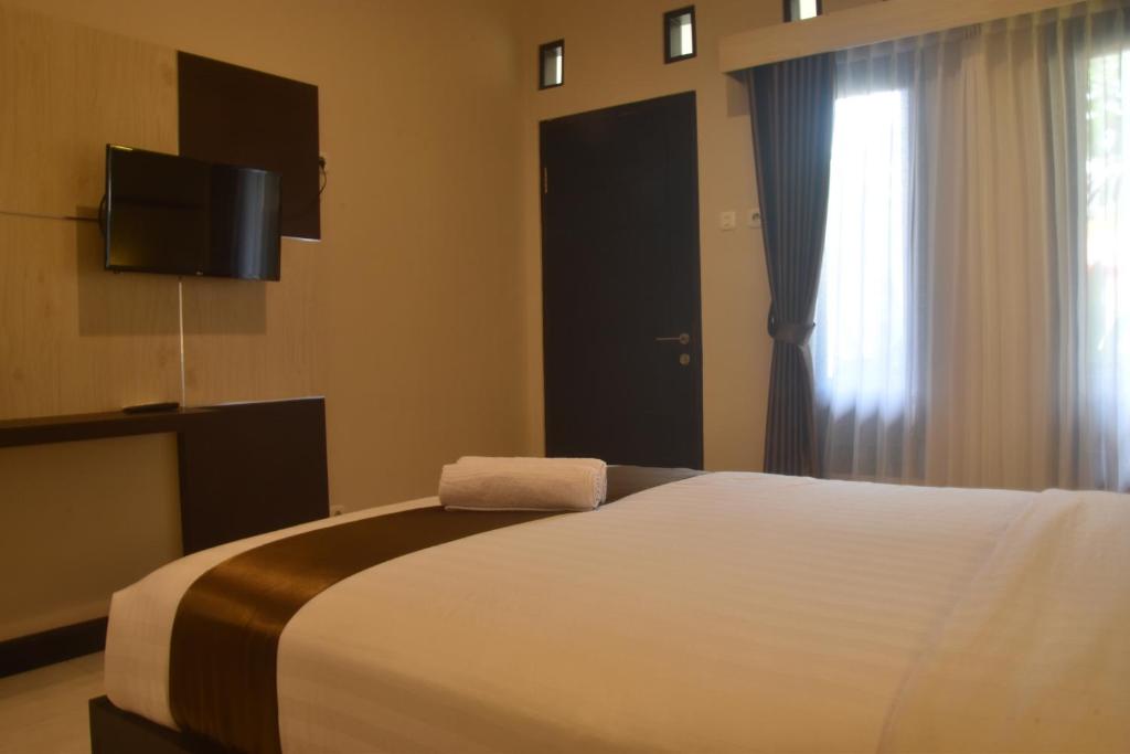 Postel nebo postele na pokoji v ubytování Hotel Orizatha