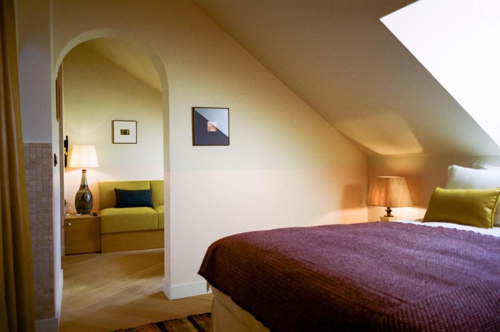 מיטה או מיטות בחדר ב-Hotel Habituel