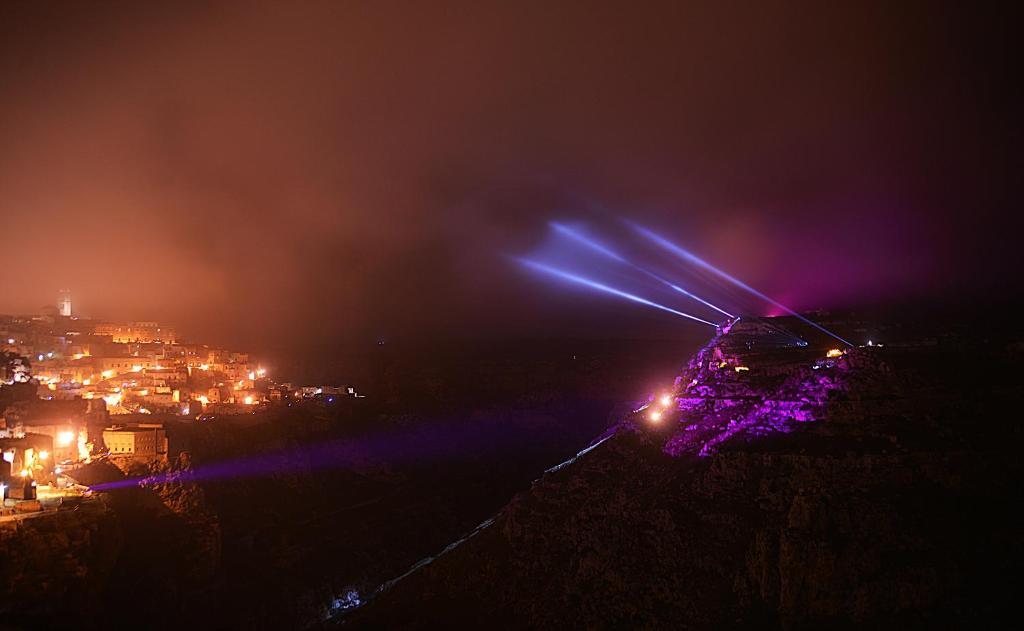 a city at night with lights on a hill at Il Belvedere in Matera