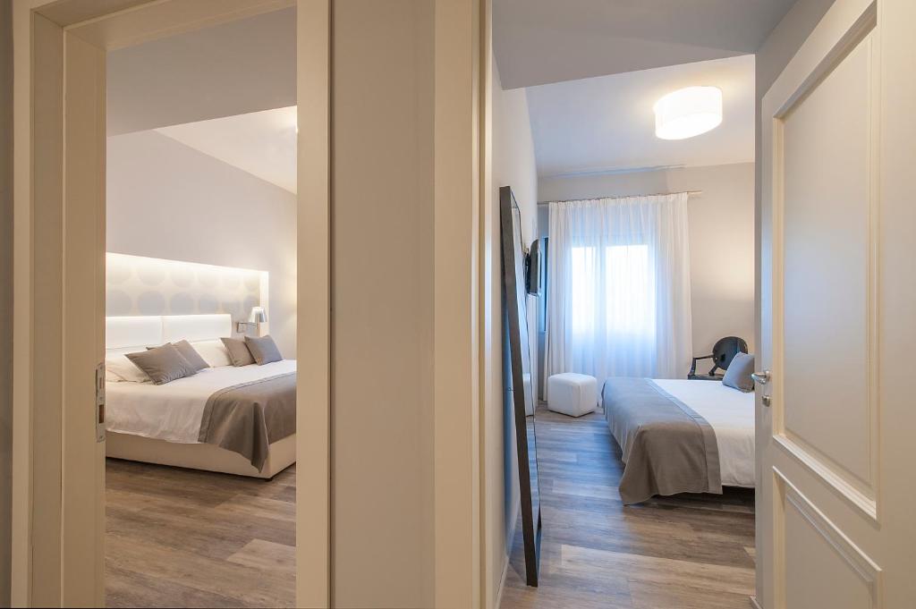 Postel nebo postele na pokoji v ubytování Hotel Monte Meraviglia
