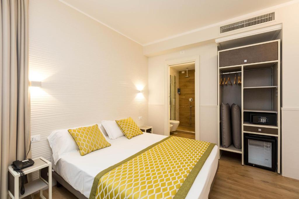 Postel nebo postele na pokoji v ubytování Hotel Marco Polo Rome