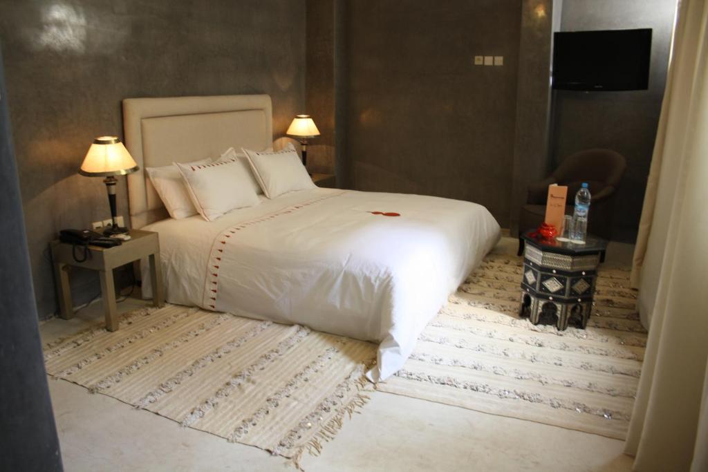 Postel nebo postele na pokoji v ubytování Riad Shama Suites & Spa
