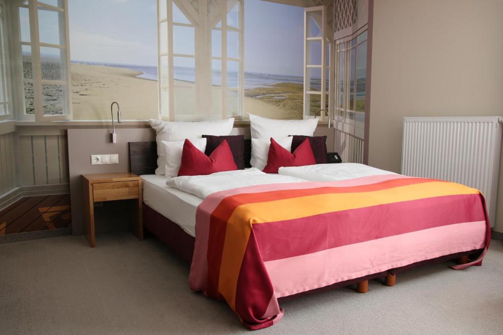 Postel nebo postele na pokoji v ubytování Hotel Am Kloster