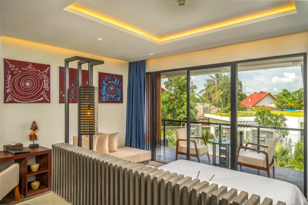 Postel nebo postele na pokoji v ubytování Metta Residence & Spa