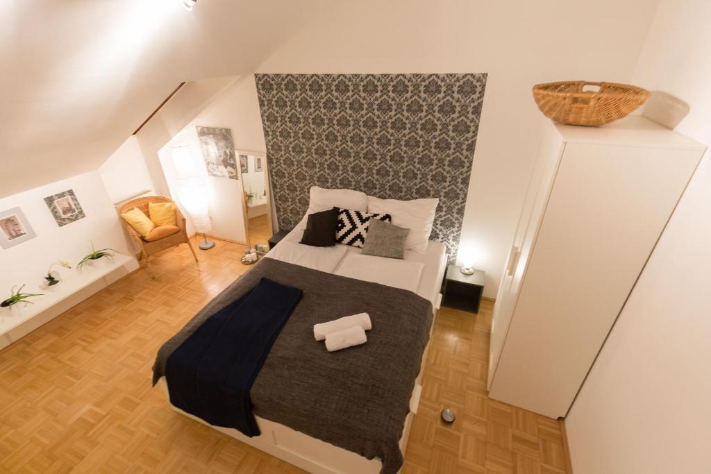 a bedroom with a large bed in a room at Studio Vienna Central Station in Vienna