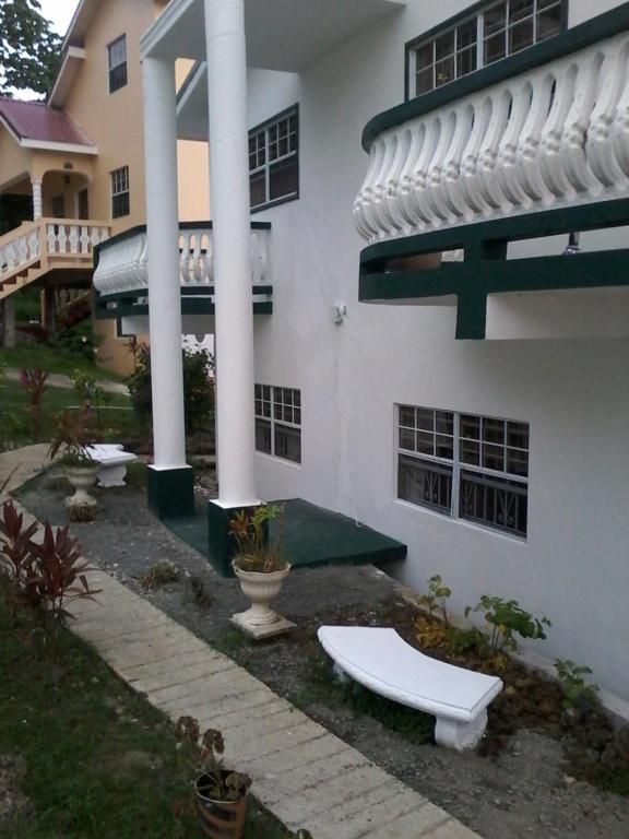 a building with a toilet in front of it at Apartment Joanna in Rodney Bay Village