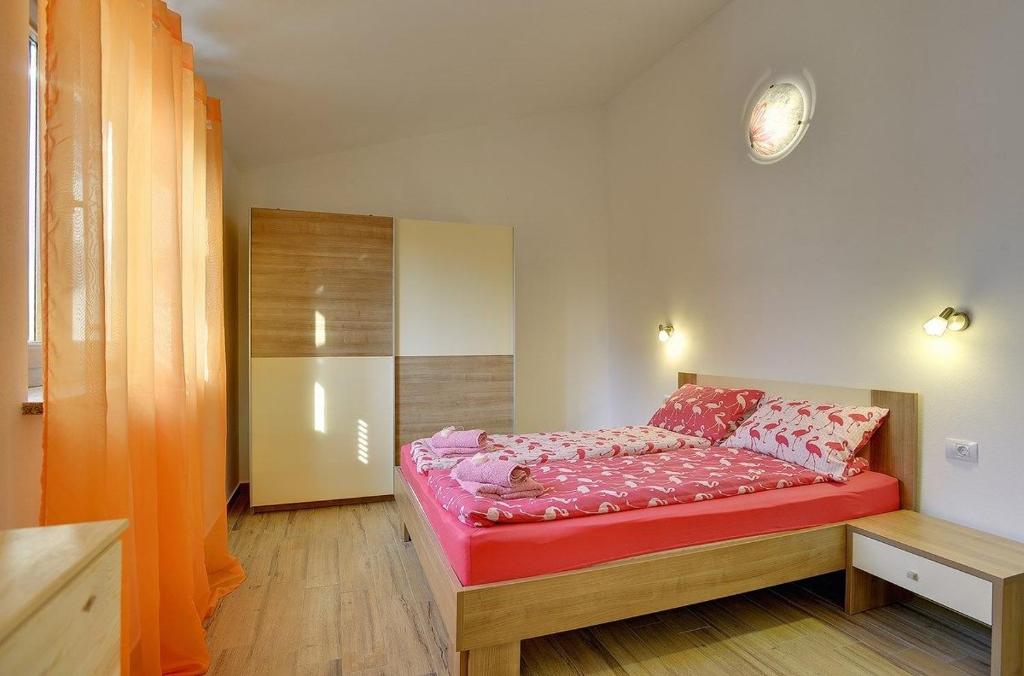 Postel nebo postele na pokoji v ubytování Villa Mareti