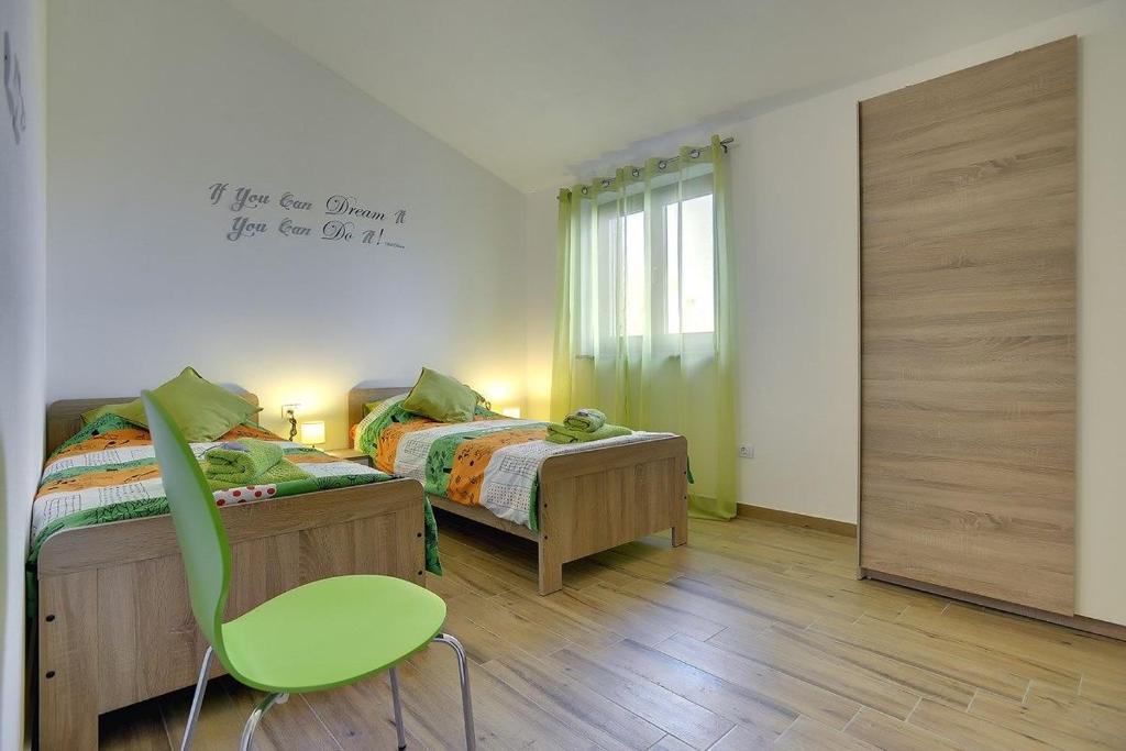 Postel nebo postele na pokoji v ubytování Villa Mareti