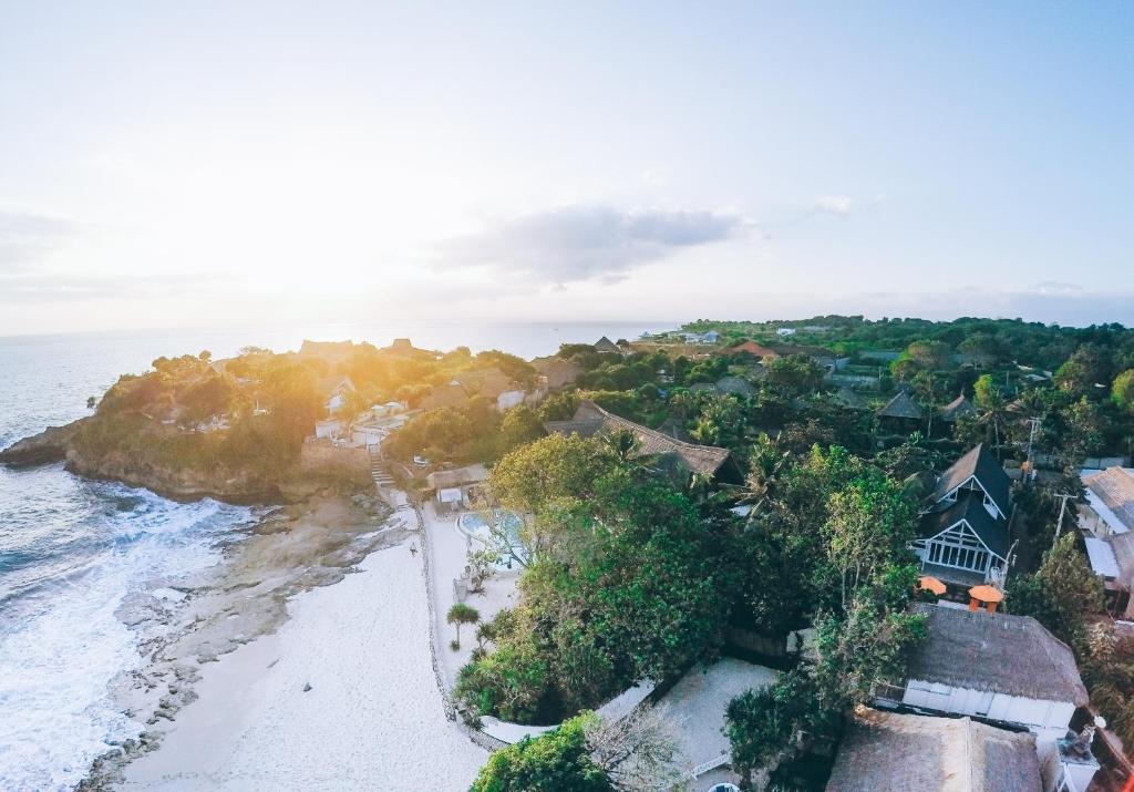 an aerial view of a beach with a house at Villa Waru One in Nusa Lembongan
