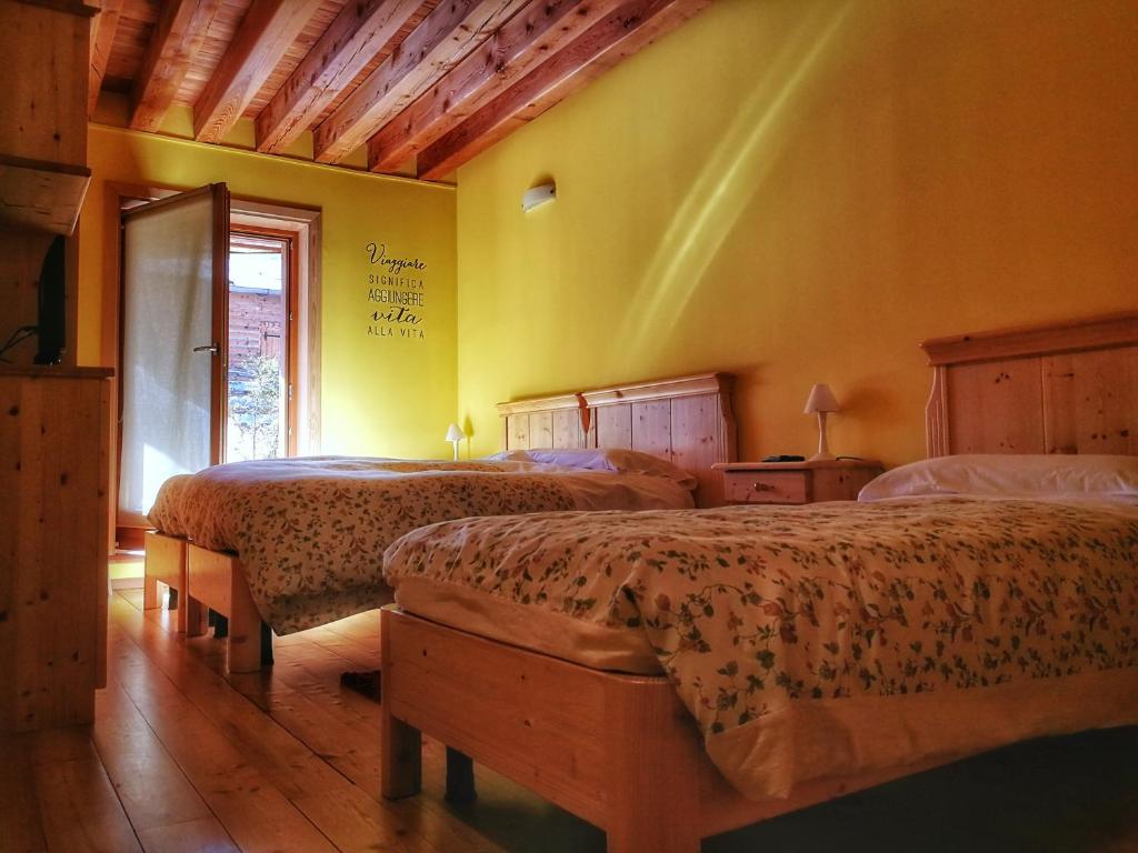 Postel nebo postele na pokoji v ubytování Baita Deona